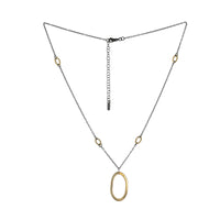 Large 14K yellow gold pendant on an oxidized sterling silver rolo chain highlighted by four smaller 14K gold links.