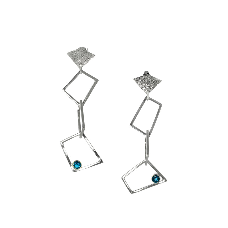 Contemporary trapezoid dangle earrings, handcrafted from Argentium and sterling silver and set with London blue topaz stones. 