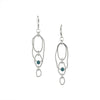 Contemporary dangle earrings, handcrafted from rings of Argentium sterling silver set with 4mm London blue topaz stones.  Lever back ear wires.