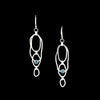 Contemporary dangle earrings, handcrafted from rings of Argentium sterling silver set with 4mm London blue topaz stones.  Lever back ear wires.