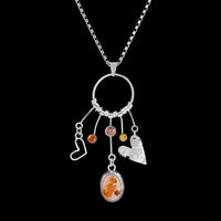 One-of-a-kind statement necklace features a pendant handcrafted from sterling silver and set with a Mexican fire opal cabochon, peach Oregon sunstone, dark gold citrine and an orange sapphire.  Sterling silver chain.