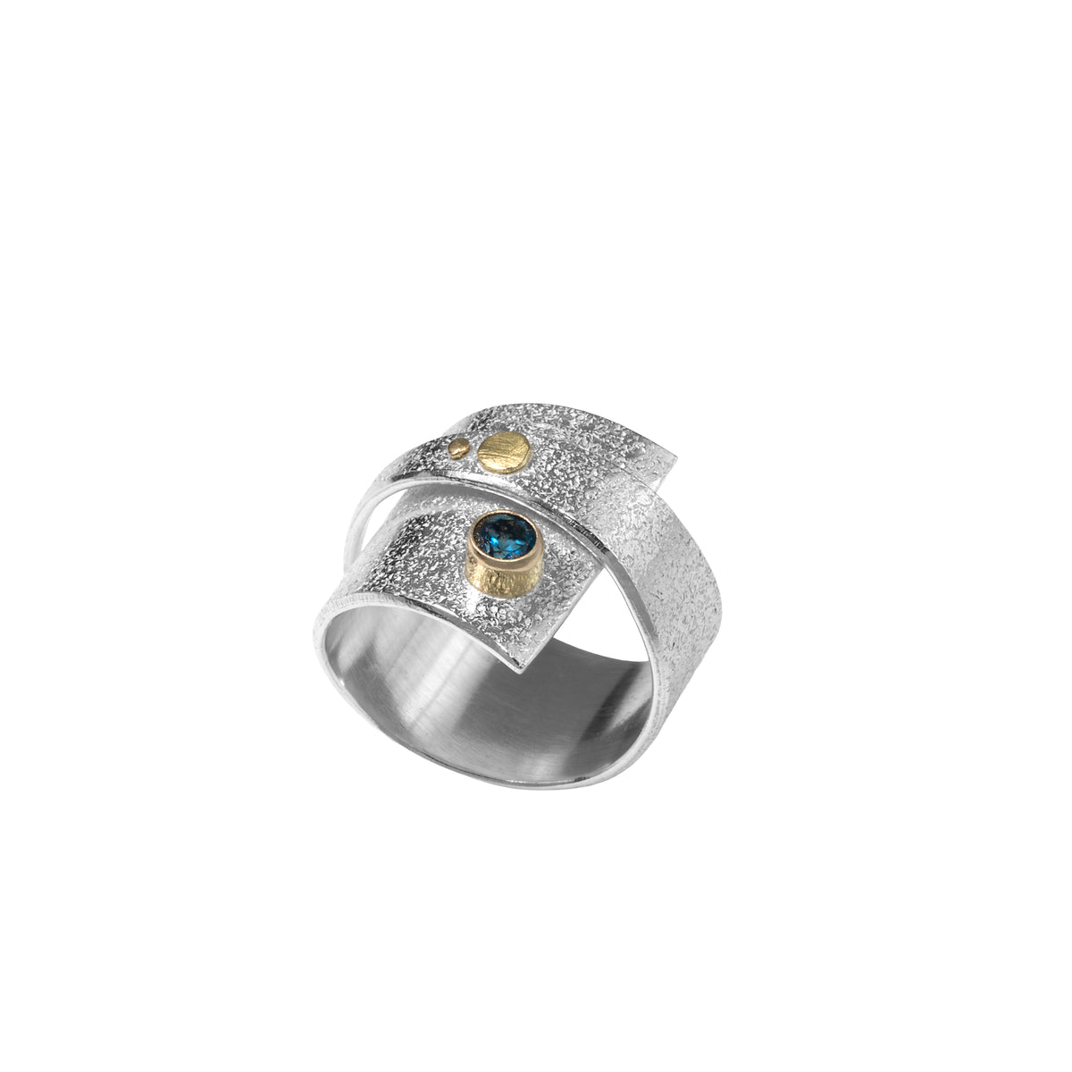 Contemporary sterling silver wrap ring with 14k gold elements and a 4mm London blue topaz set in 14k gold.