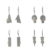 Argentium sterling silver and 18K gold earrings with contemporary geometric styling.