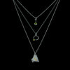 Oxidized argentium sterling silver and 18K gold charm pendant necklace with contemporary geometric styling.  Shown in a layered look.