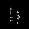 Asymmetric drop earrings handcrafted from Argentium sterling silver and London Blue topaz gemstones set in 18k gold bezels. Silver ear wires accented with 18k gold elements. 