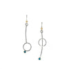 Asymmetric drop earrings handcrafted from Argentium sterling silver and London Blue topaz gemstones set in 18k gold bezels. Silver ear wires accented with 18k gold elements. 