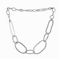 Tangled rings of Argentium sterling silver handcrafted into a chain necklace with a modern, organic design.