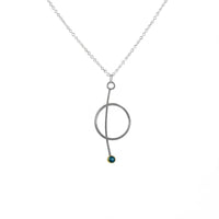 Contemporary pendant necklace handcrafted from Argentium sterling silver with a London Blue topaz set in 18k yellow gold. 