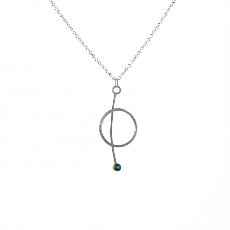 Contemporary pendant necklace handcrafted from Argentium sterling silver with a London Blue topaz set in 18k yellow gold. 