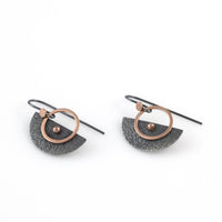 Handcrafted earrings featuring textured and oxidized Argentium silver discs highlighted with 14K rose gold elements and wire.