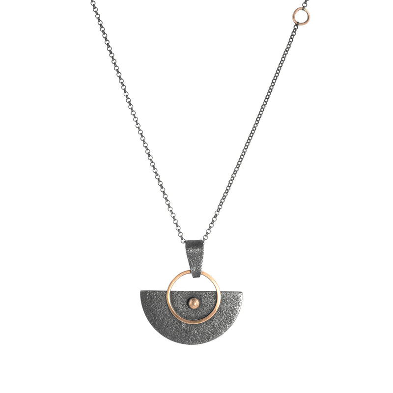 Crescent-shaped pendant necklace handcrafted with oxidized Argentium sterling silver and 14K rose gold elements and wire. Sterling silver chain with 14K gold accents. 