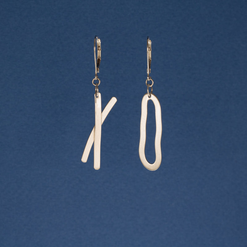 Asymmetrical, “exes and ohs” dangle earrings, handcrafted from textured Argentium silver with a sterling silver lever back.