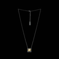 Contemporary pendant necklace handcrafted from oxidized Argentium and sterling silver highlighted with a freshwater pearl in an18K gold cup.  Silver chain.