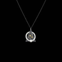 Contemporary design pendant necklace handcrafted from Argentium sterling silver with 18K gold elements and a white freshwater pearl.