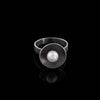 Contemporary design ring handcrafted from oxidized sterling silver with a white freshwater pearl.