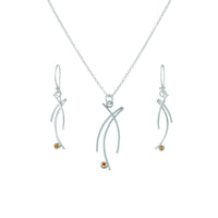 Contemporary design, dangle earrings handcrafted from Argentium sterling silver and set with golden citrines.   Shown with matching pendant necklace.