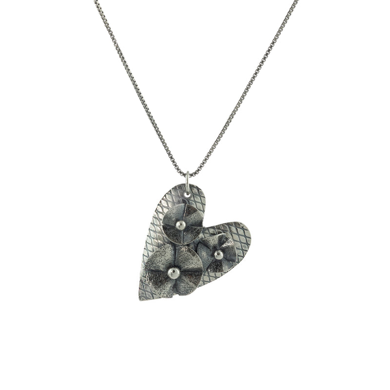 Hand-fabricated, one-of-a-kind heart pendant made with sterling and fine silver on a silver box chain. 