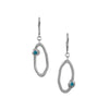 Handcrafted dangle earrings in Argentium sterling silver set with London blue topaz stones.  Sterling silver lever back ear wires.