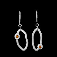 Handcrafted dangle earrings in Argentium sterling silver set with yellow citrines.  Sterling silver lever back ear wires.