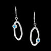 Handcrafted dangle earrings in Argentium sterling silver set with London blue topaz stones.  Sterling silver lever back ear wires.