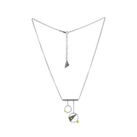 Contemporary, geometric design pendant necklace, handcrafted from oxidized Argentium sterling silver with 18K gold elements and a green peridot set in 18K gold.