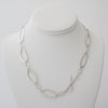 Contemporary, asymmetrical chain necklace, handcrafted in Argentium sterling silver.