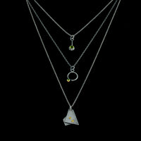 Geometric design pendants, handcrafted with Argentium sterling silver and green peridots set in 18K gold bezels.  Sterling silver chain.