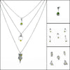 Geometric design pendants, handcrafted with Argentium sterling silver and green peridots set in 18K gold bezels.  Sterling silver chain.