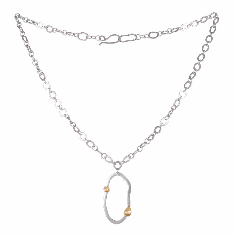 Modern design chain necklace with links individually hand-fabricated from Argentium sterling silver and 18K gold accents on the pendant.