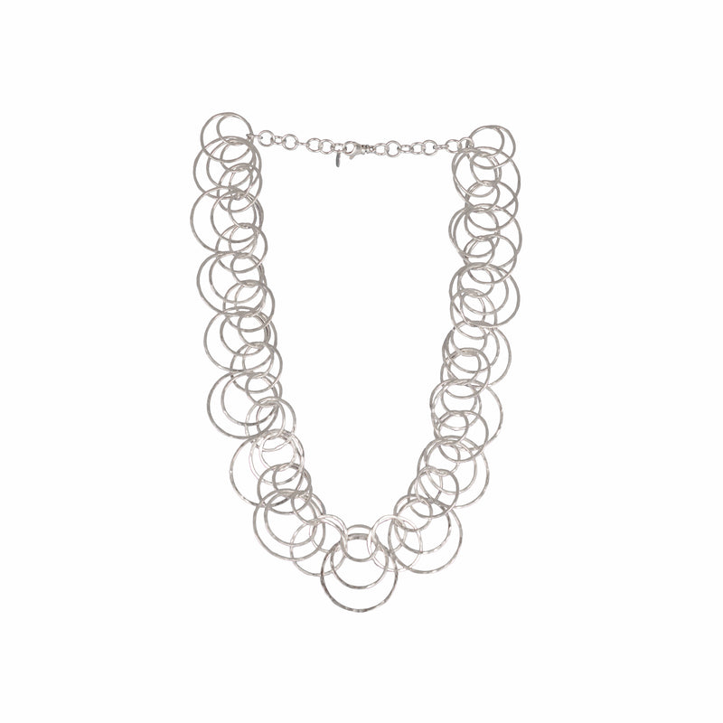 Statement necklace handcrafted from dozens of hammered rings of Argentium sterling silver.