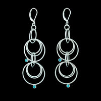 Contemporary dangle earrings, handcrafted in hammered Argentium sterling silver and set with 3mm blue zircons.