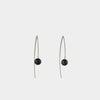 Hand fabricated drop earrings, showcasing black freshwater pearls on Marquise-shaped Argentium sterling silver ear wires.