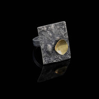 Statement ring, handcrafted from oxidized Argentium and sterling silver, highlighted by an 18K gold cup.